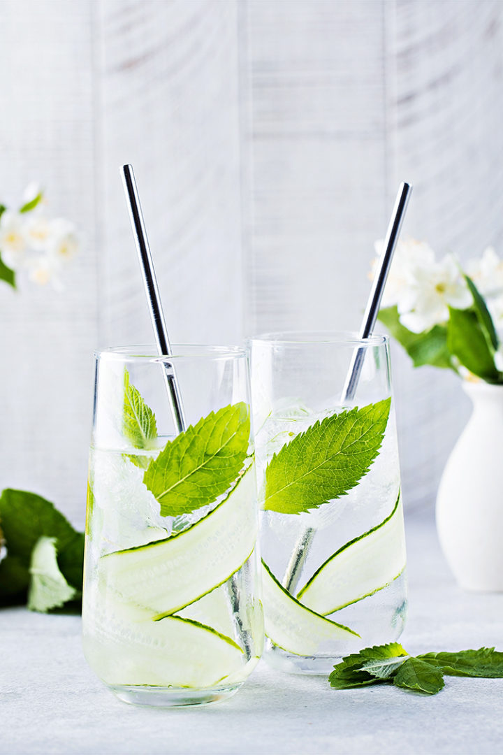 photo of two glasses of cucumber mint water #infusedwater #cucumberwater #mintwater #cucumbermintwater #cucumberandmintwater #freshcucumberwater #cucumberwaterrecipe #spawater #detoxwater #waterinfusedwithcucumber #herbwater