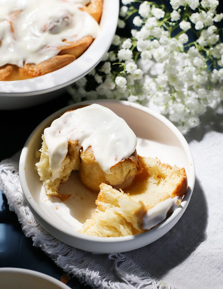 photo of a lemon roll with lemon cream cheese icing on a plate