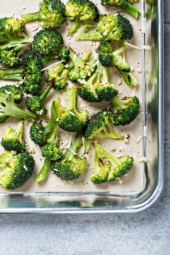 overhead photo of roasted broccoli with garlic and parmesan