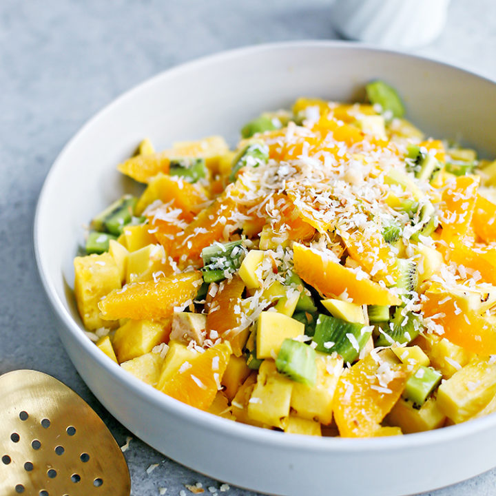 a photo of tropical fruit salad in a serving bowl