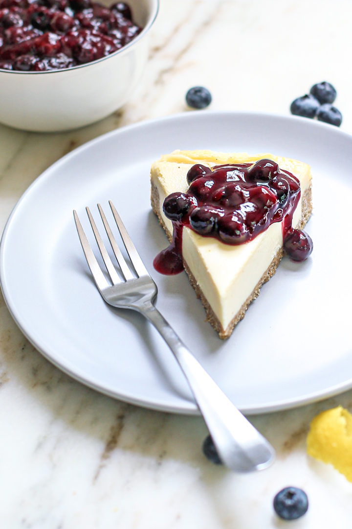 lemon blueberry sauce on a cheesecake