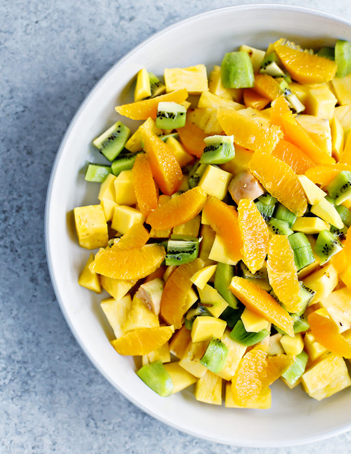 a photo of cut up tropical fruit in a bowl