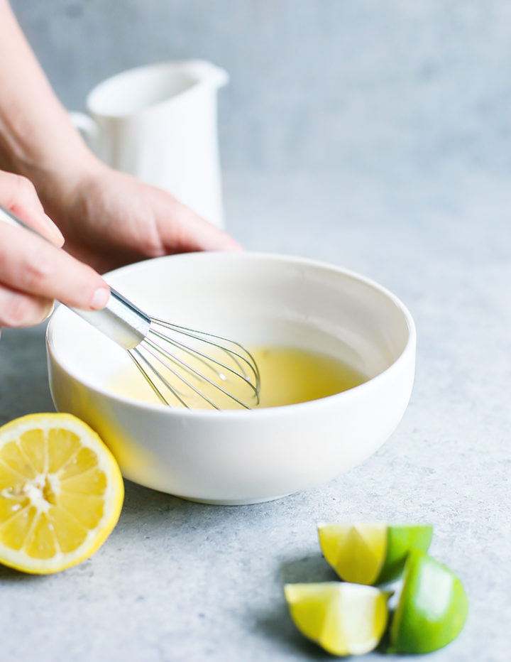 photo of a woman making sweet and sour mix for a mai tai cocktail