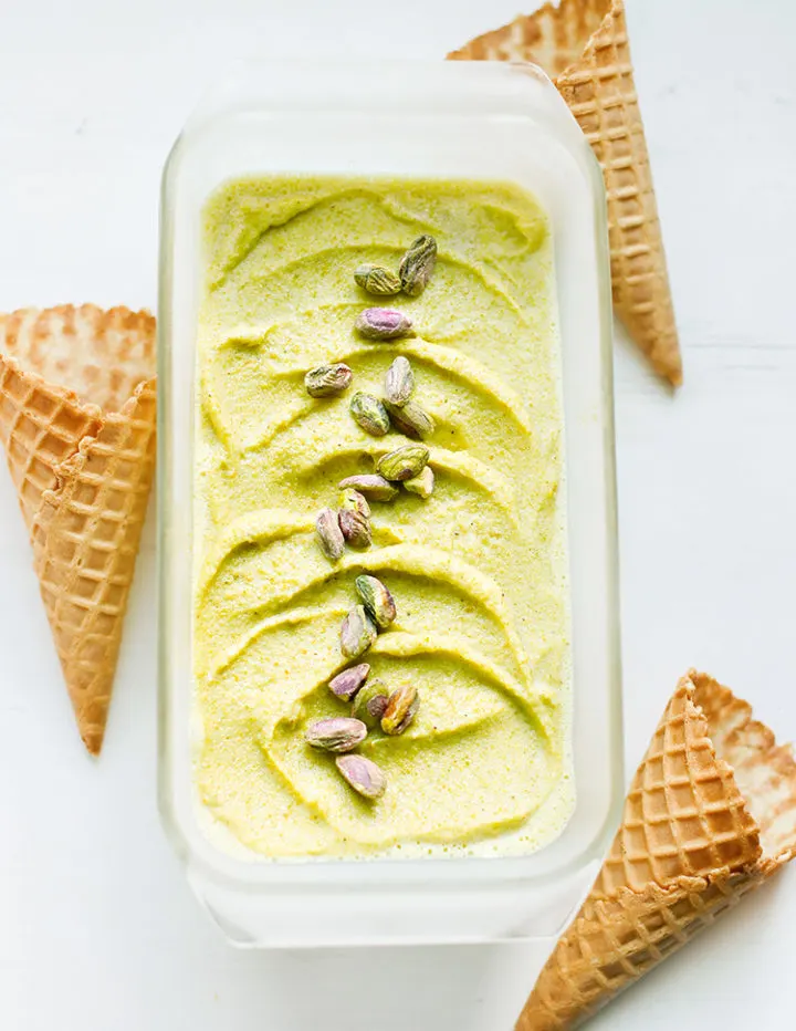 photo of pistachio gelato in a storage container