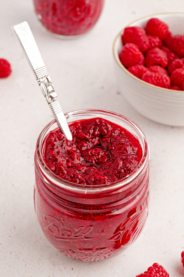 photo of raspberry jam in a jam jar for a recipe to make chia jam