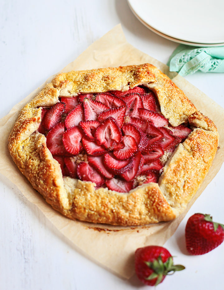 photo of a baked strawberry galette on a white table