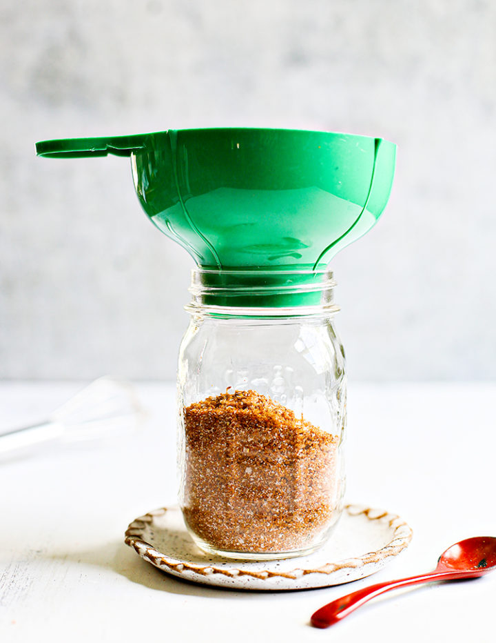 photo of pouring chicken rub into a glass jar