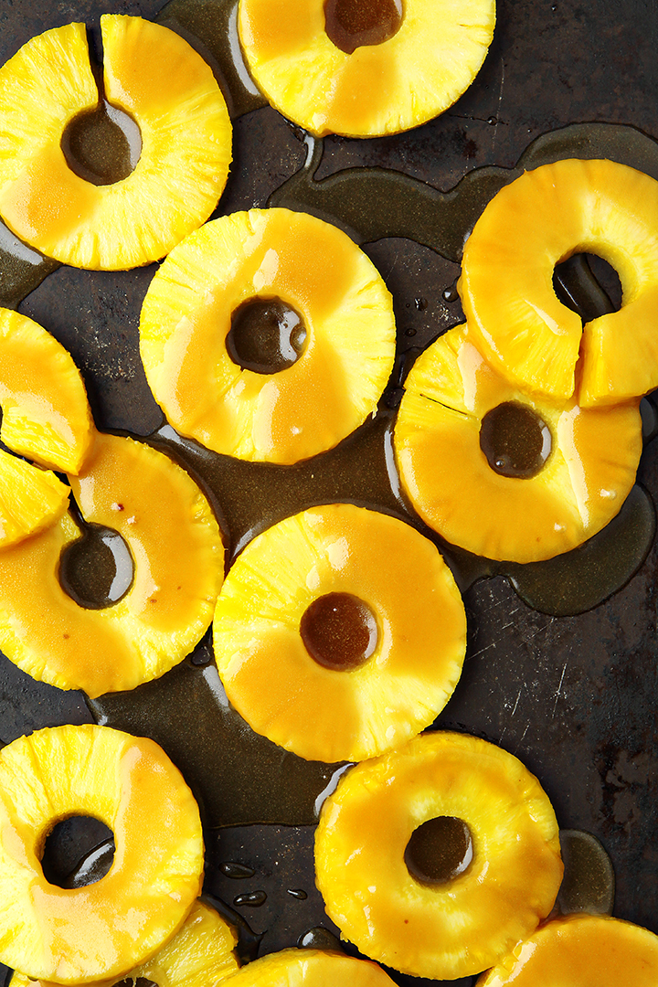 photo of pineapple rings with brown sugar glaze getting ready to be cooked on the grill