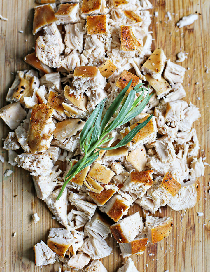 close up photo of chopped chicken with tarragon for a tarragon chicken salad recipe