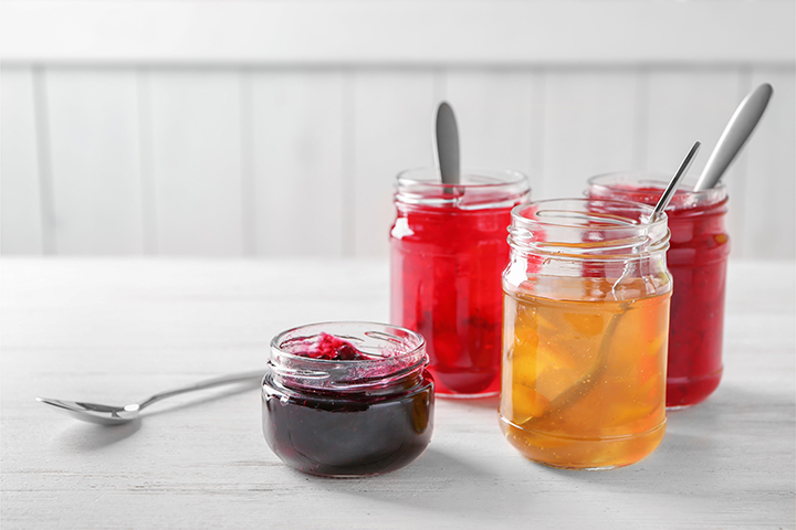 a photo of jam jars with a spoon to explain how to open a jar with a spoon