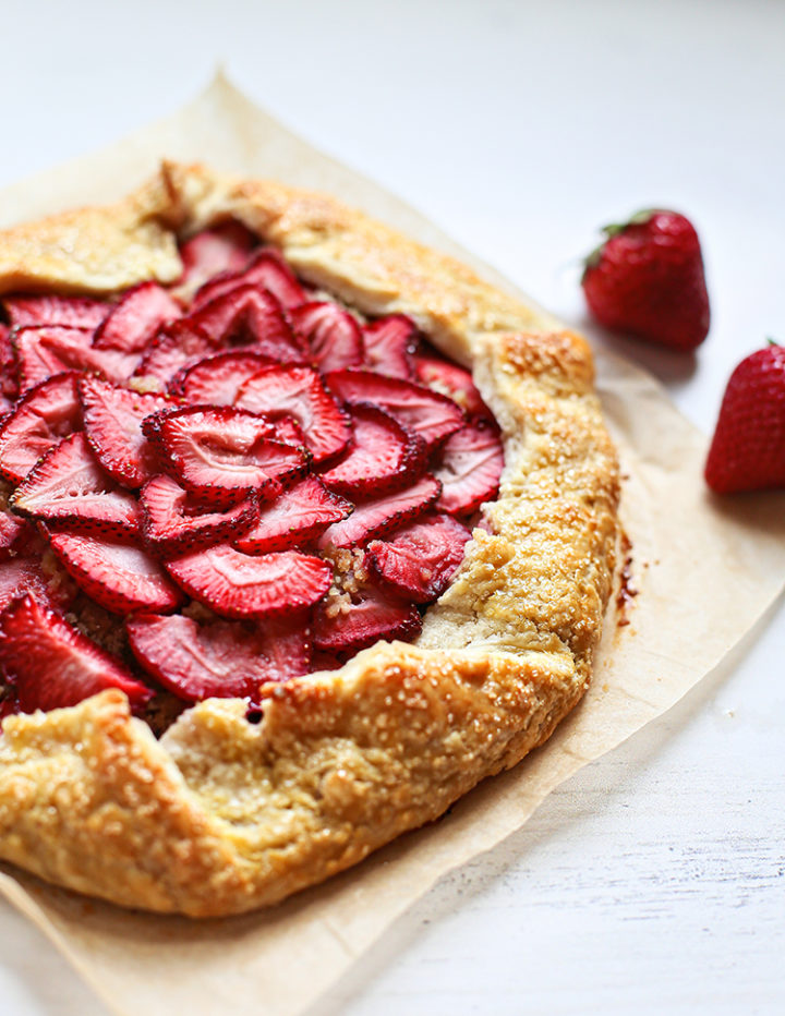 photo of a strawberry galette on parchment paper