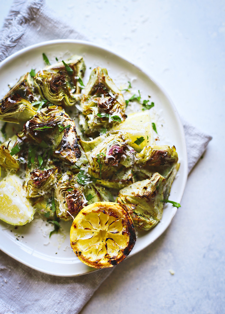 photo of grilled baby artichokes on a plate
