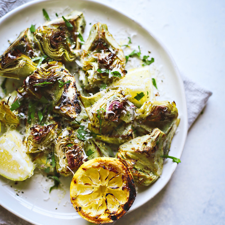 photo of grilled baby artichokes on a plate