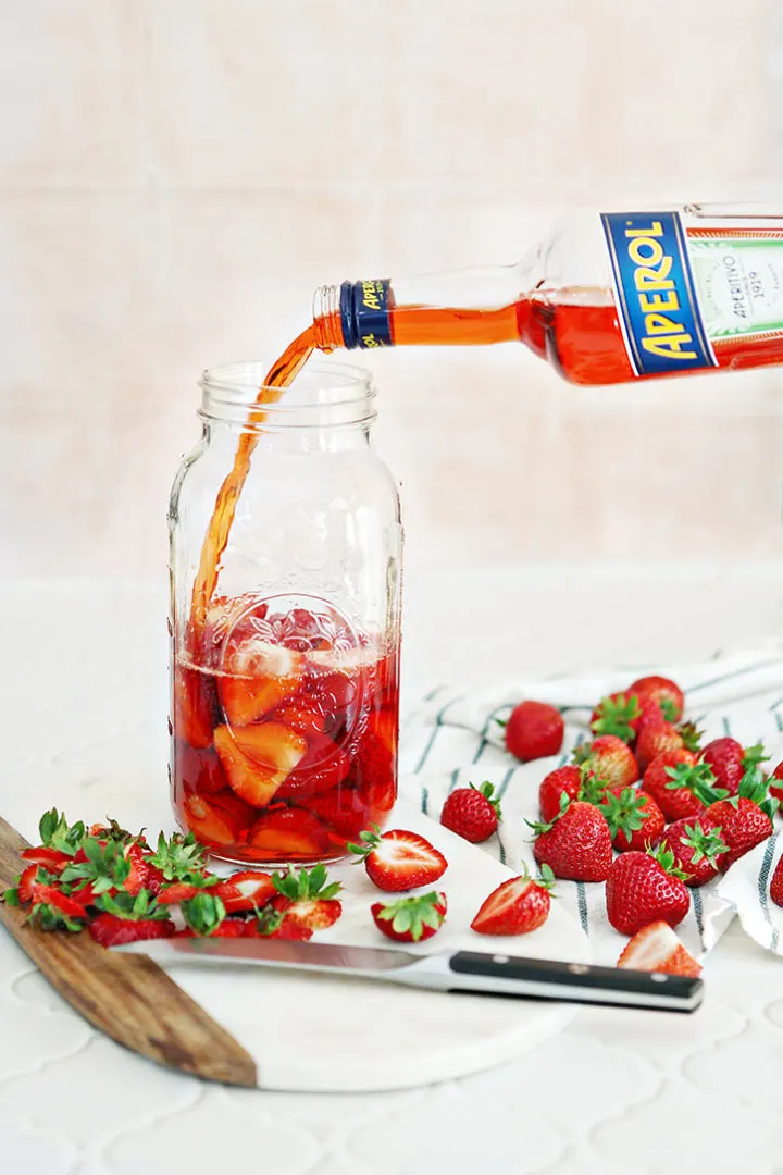 photo of making strawberry infused aperol for an aperol spritz recipe
