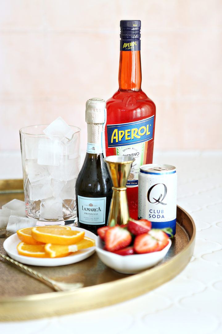 photo of ingredients in an aperol spritz with strawberries