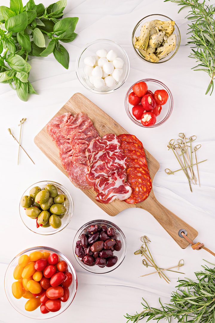 overhead photo of ingredients to make antipasto skewers for an antipasto wreath recipe