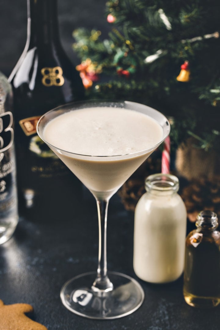 photo of a gingerbread martini in front of a christmas tree