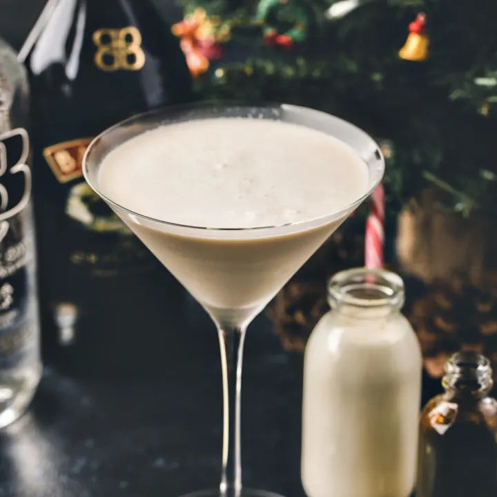 photo of a gingerbread martini in front of a christmas tree