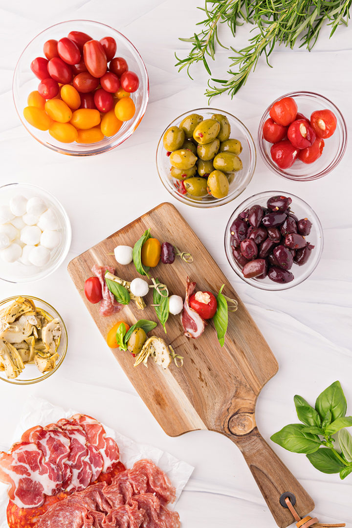 overhead photo of preparing antipasto skewers for an appetizer