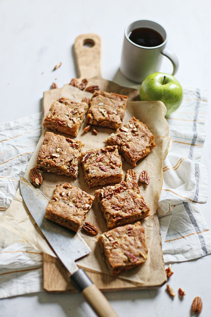 cinnamon pecan apple squares sliced on a cutting board