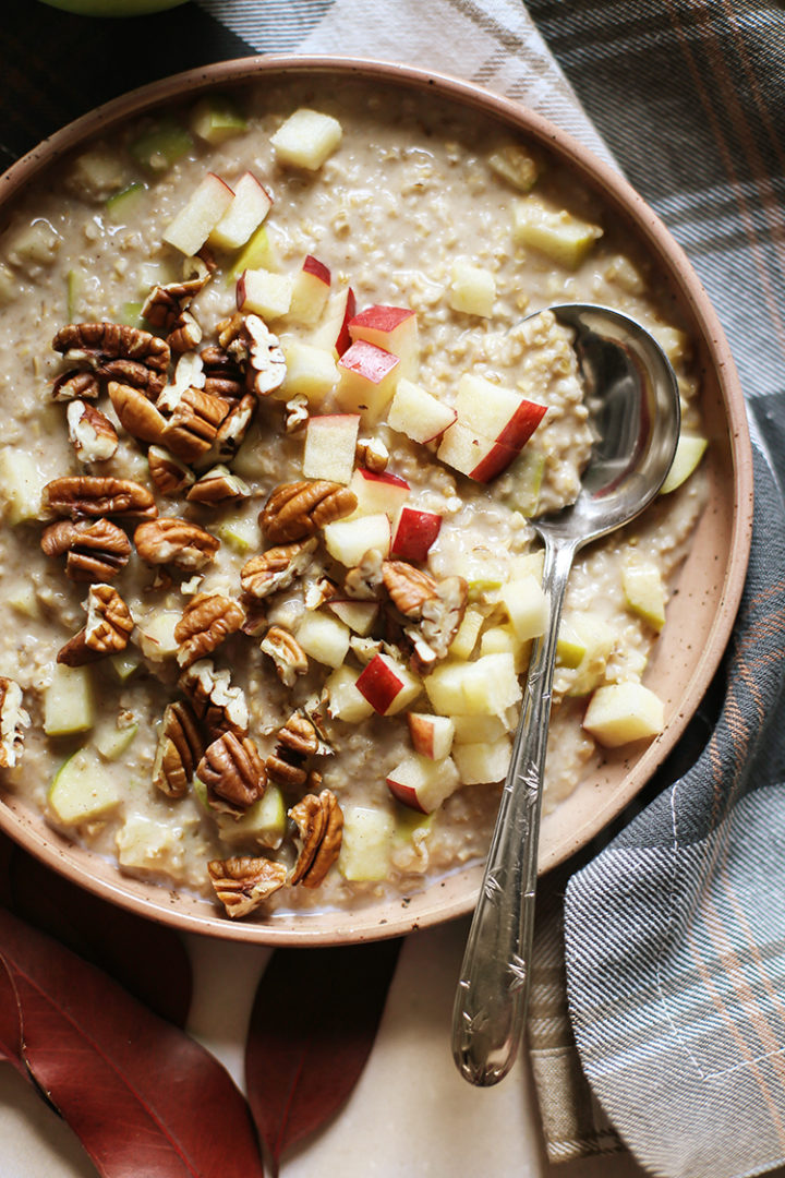 closeup overnight shot of a bowl of apple oatmeal with a spoon