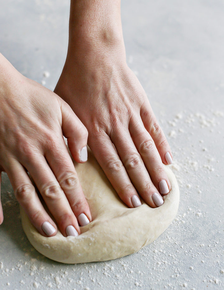 woman making pizza dough for barbecue chicken pizza