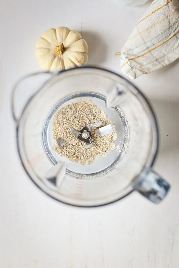 photo of oatmeal in a blender for a pumpkin smoothie recipe