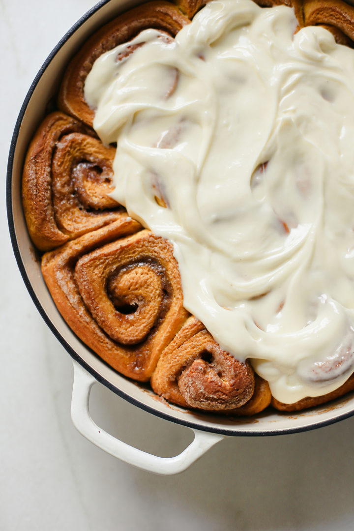 photo of pumpkin spice cinnamon rolls in a pan