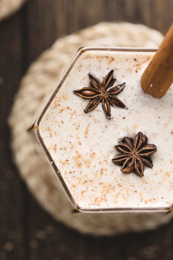 closeup overhead of a glass of spiked eggnog