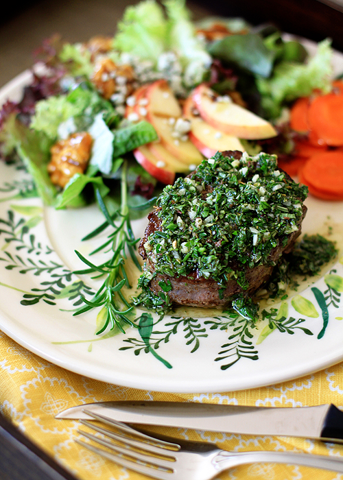 photo of a seared filet mignon topped with gremolata