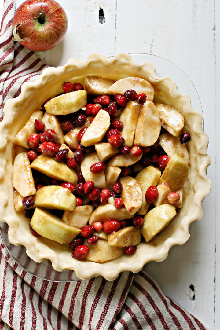 overhead photo of a butter pie crust being used to bake a pie recipe