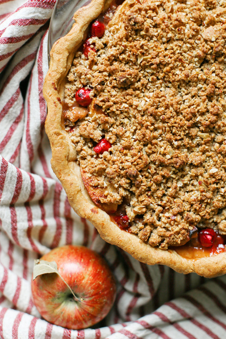 overhead photo with a close up of the crumble topping on apple cranberry pie