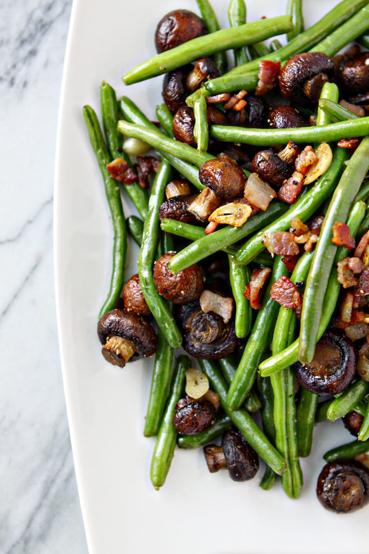 overhead photo of a plate of sautéed green beans and bacon 