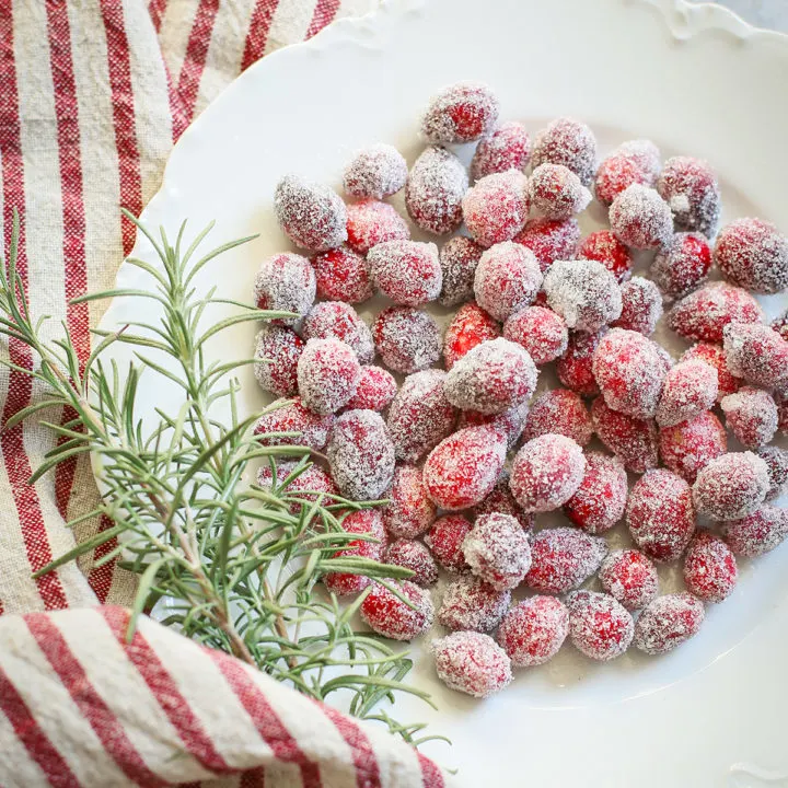 sugared cranberries on a white plate