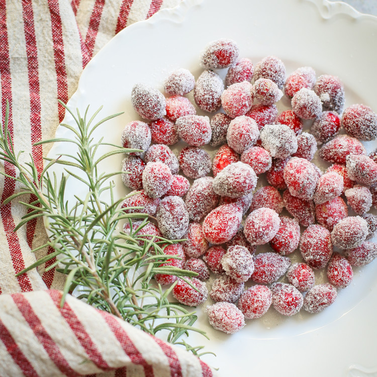 sugared cranberries on a white plate