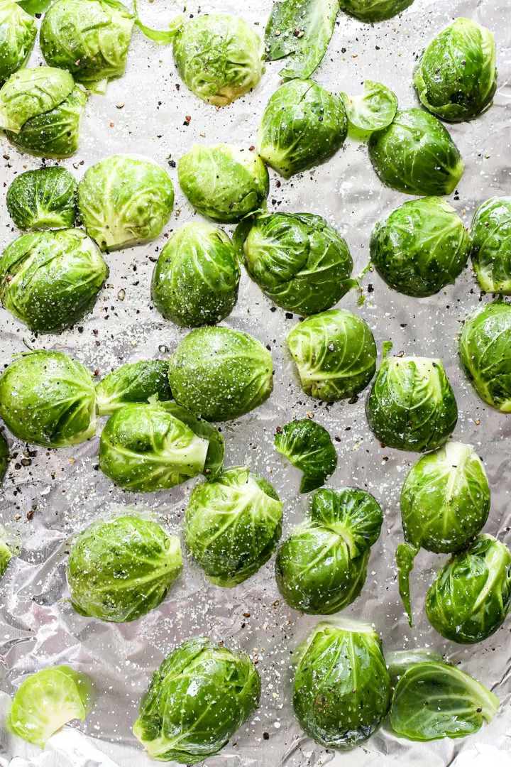photo of brussels sprouts on a baking pan to cook brussels sprouts in the oven