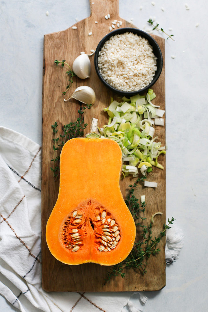 photo of ingredients in this recipe for butternut squash risotto on a wooden cutting board