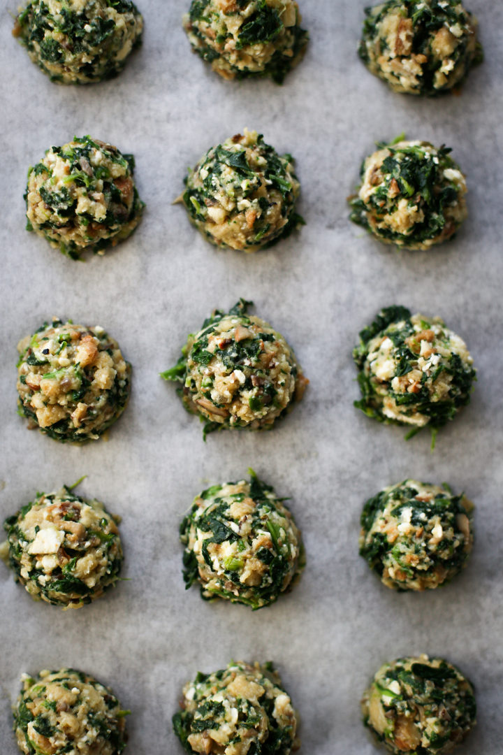 photo of spinach balls being placed on a baking sheet