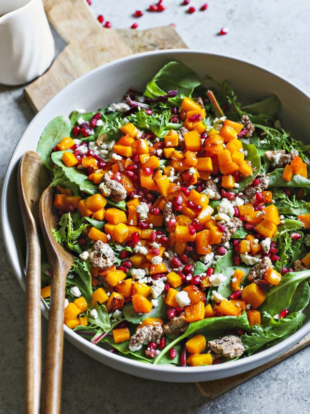 photo of a bowl of salad garnished with glazed walnuts