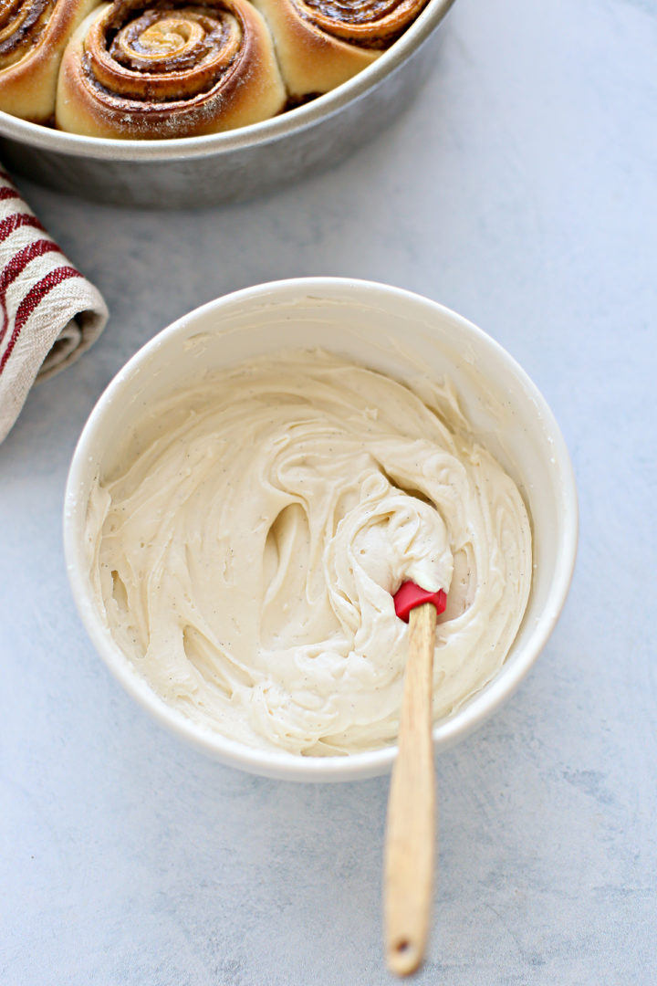 photo of bourbon cream cheese frosting in a bowl for frosting this homemade cinnamon roll recipe