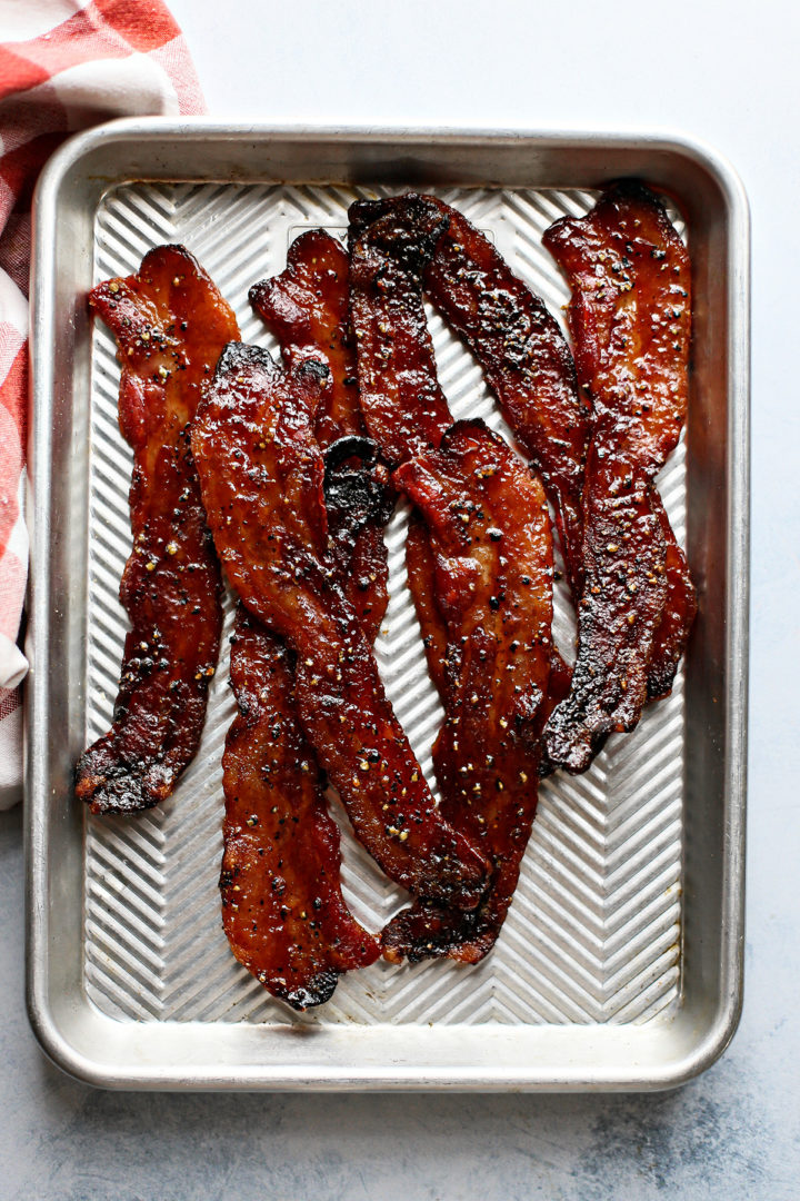 candied bacon on a baking sheet before serving