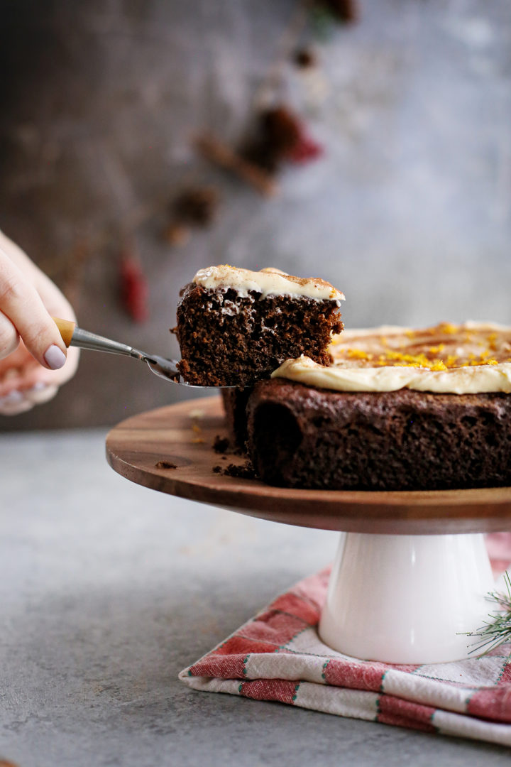 photo of a woman serving this chocolate gingerbread cake recipe