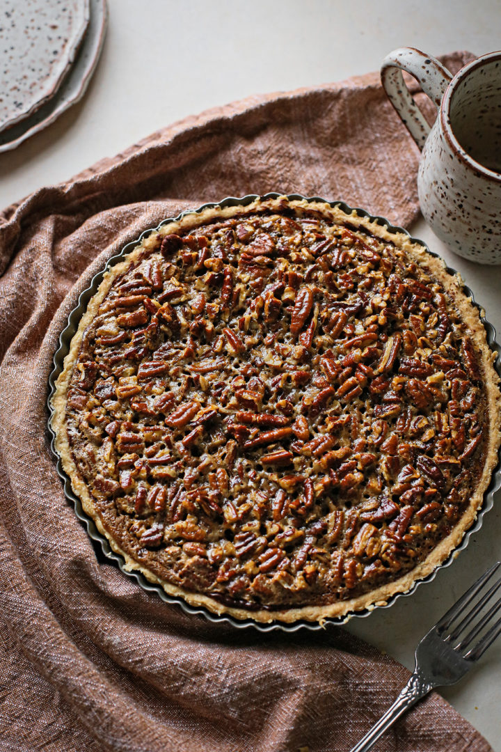photo of a baked chocolate pecan tart for this chocolate pecan tartlets recipe