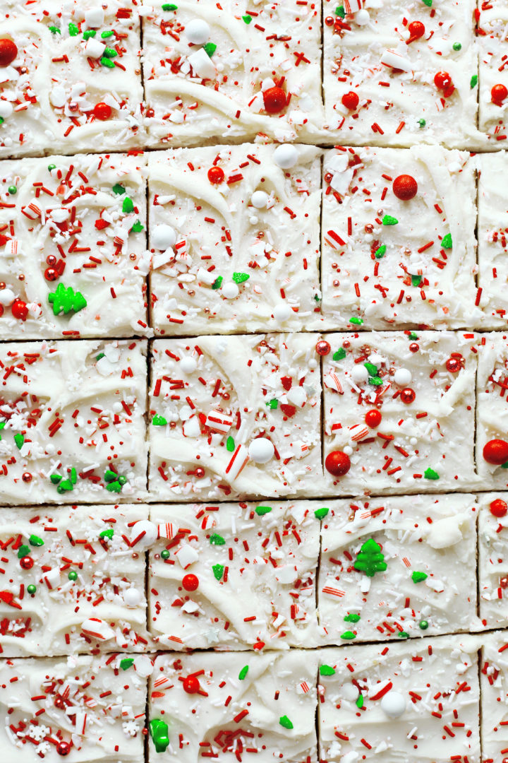 photo of decorated christmas sugar cookie bars with christmas sprinkles and crushed candy cane pieces 