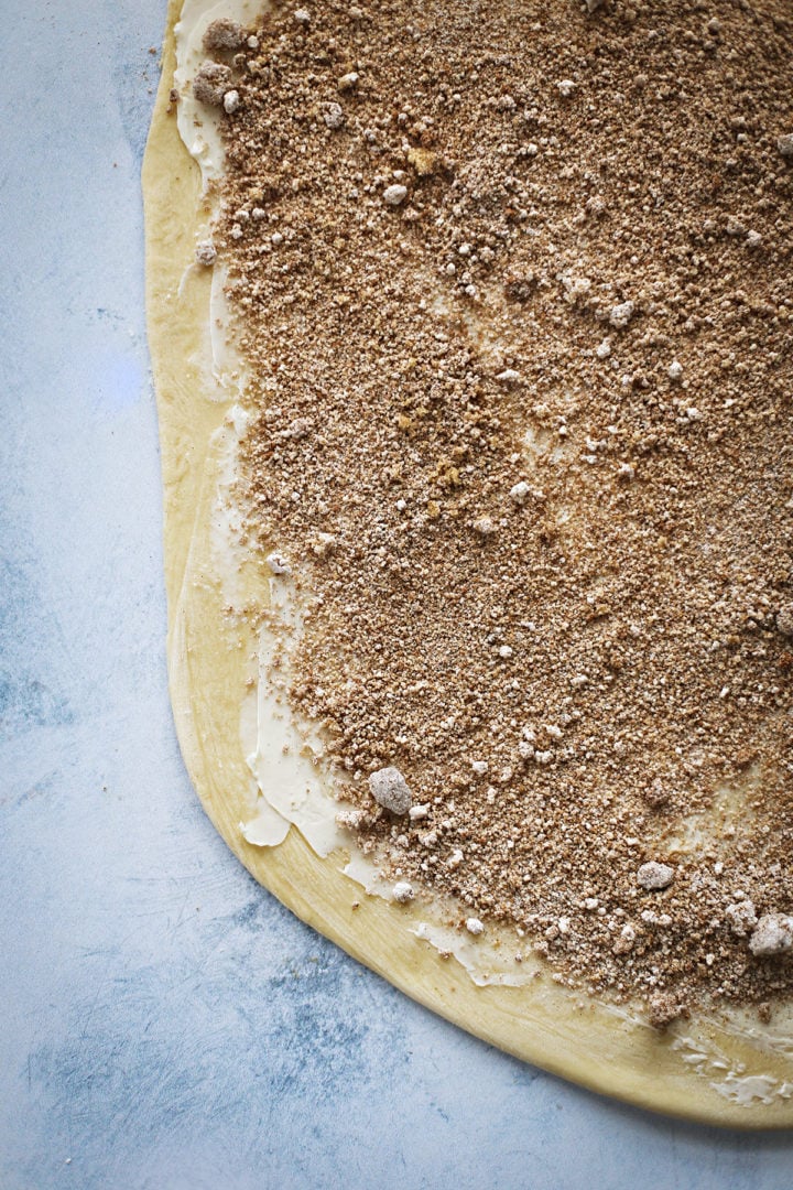 photo showing how to make homemade cinnamon rolls - adding the brown sugar and cinnamon mixture