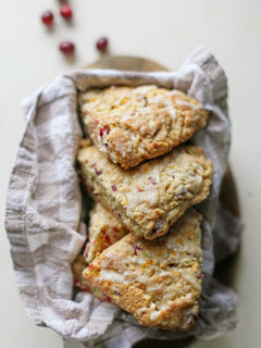 photo of cranberry orange scones in a bread basket