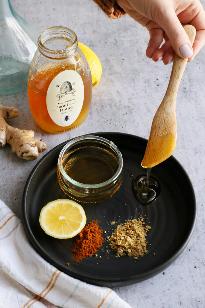 photo of honey with lemon, ginger, and cayenne to make a homemade cough syrup with honey and lemon 
