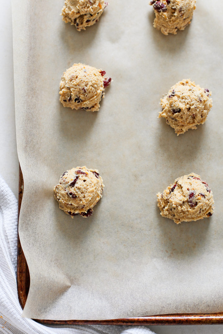 photo of persimmon cookie dough on a baking sheet with parchment paper