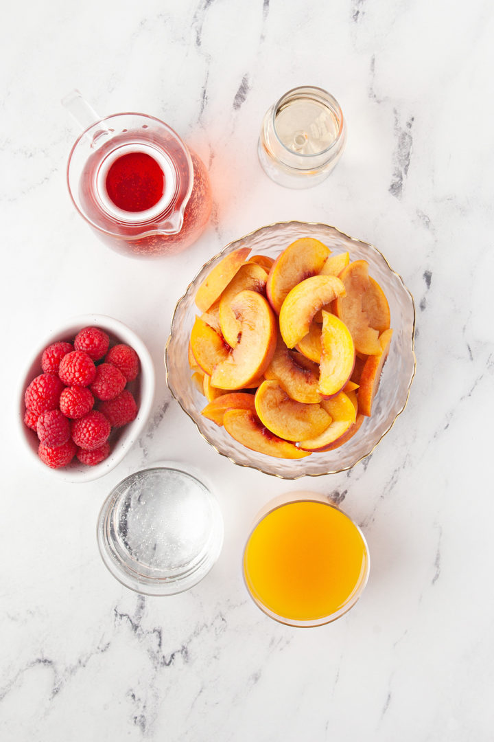 ingredients to make a peach cocktail called peach sangria