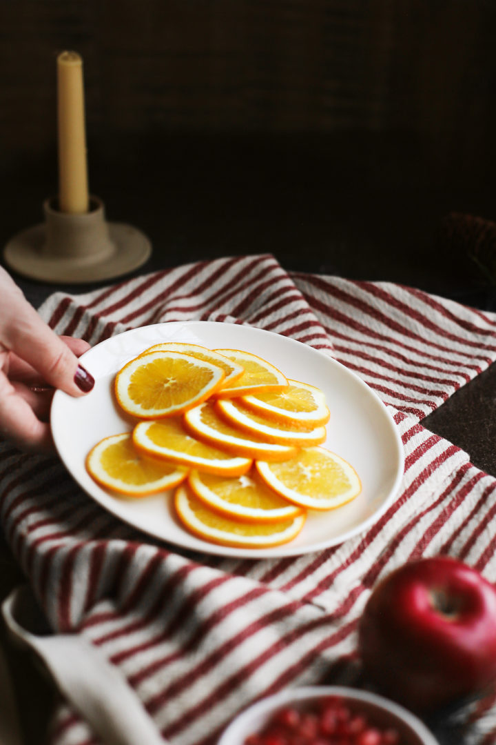 a plate of oranges for hot spiced apple cider